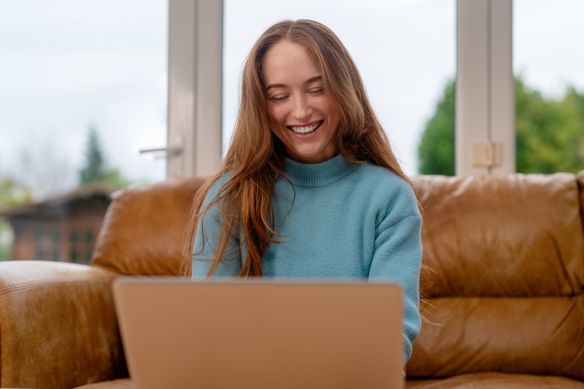 A student relaxing at a host family home in a cozy living room